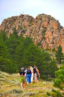 hikers approach mountain ridge