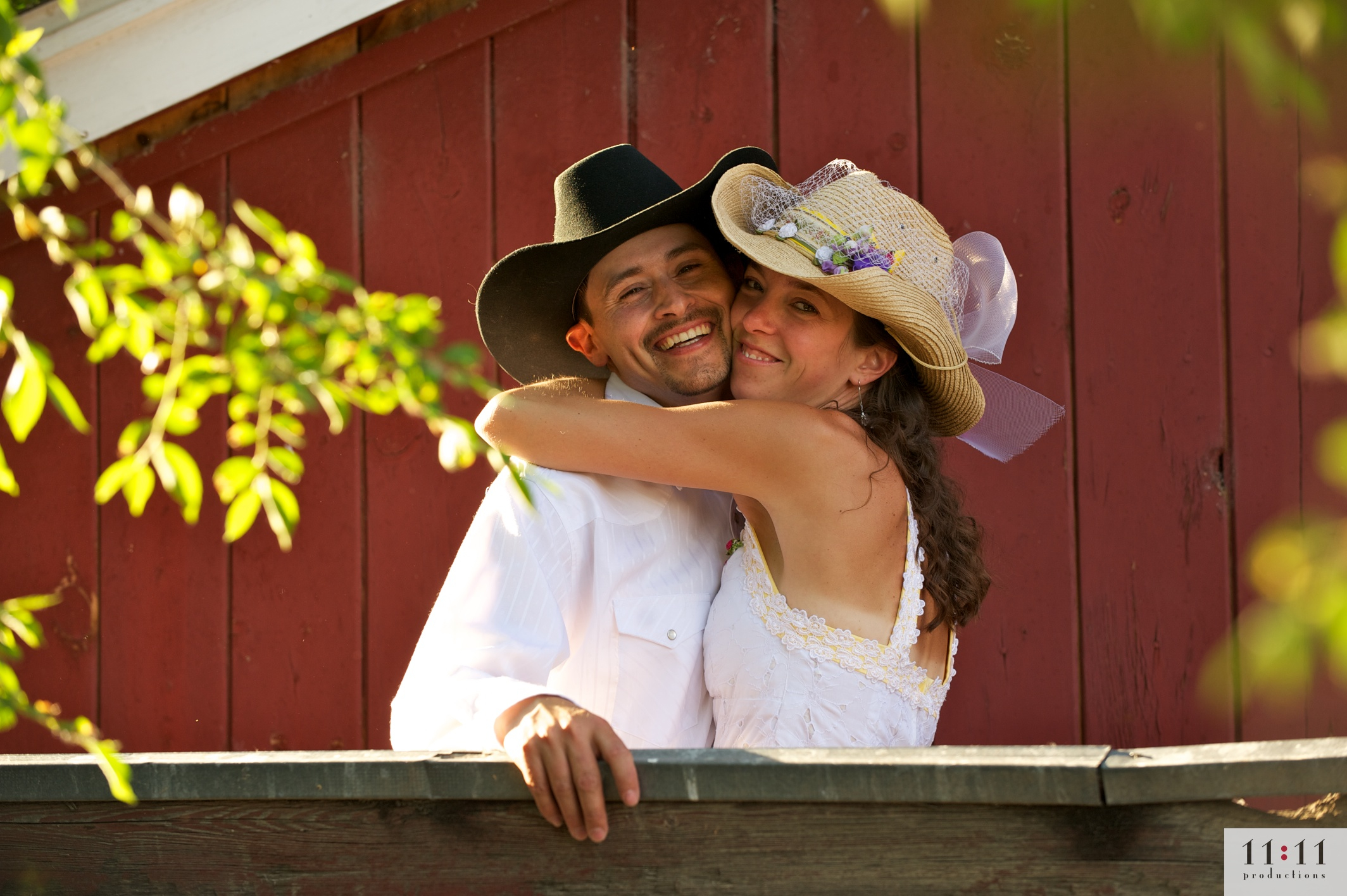 couple in front of red barn