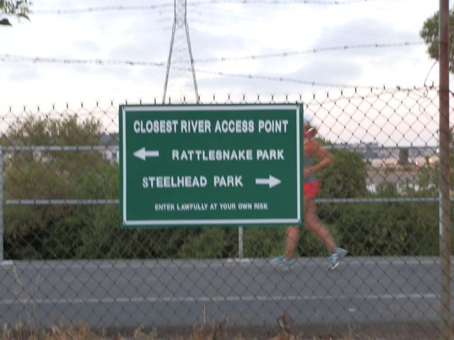 running past sign